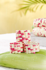 Pink and White Sweet Corn Kernels on Green Husk - Natural Organic Food Ingredient