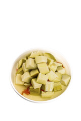 Pickled Green Mango Cubes in Bowl on White Background - Traditional Asian Sour Sweet Fruit Snack