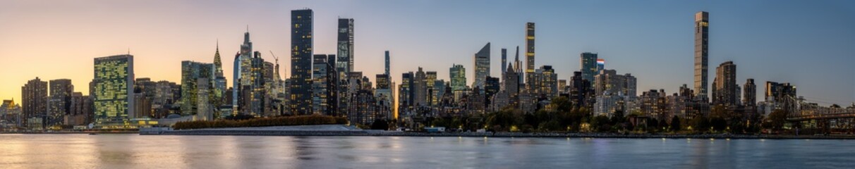 Panorama of the skyline of Midtown Manhattan with the Chrysler Building after sunset