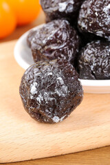 Dried Plums Umeboshi Asian Preserved Fruit on Wooden Board Traditional Sweet Sour Snack