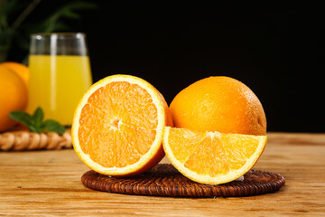Freshly Cut Orange Slices with Juice Glass on Wooden Table - Healthy Citrus Breakfast Scene