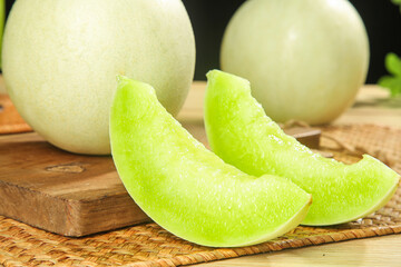 Fresh Green Honeydew Melon Slices on Wooden Cutting Board - Healthy Organic Fruit
