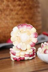 Sweet Corn Kernels Arranged Like Flower on Wooden Board - Colorful Heirloom Vegetable Display