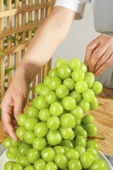 Fresh Green Grapes in Kitchen - Healthy Organic Fruit Being Handled with Care