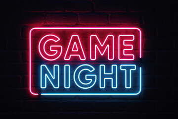Bright Neon Game Night Sign Illuminating a Dark Brick Wall Keywords: neon sign, game night, glowing, bright, electric, entertainment, fun, leisure, party, celebration, gaming, competition, retro