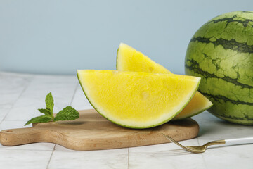 Yellow Watermelon Slices with Mint on Wooden Board - Fresh Summer Fruit