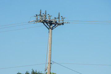 high voltage power lines on blue sky