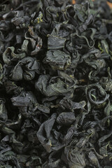 Dried Wakame Kelp Seaweed Texture Background for Asian Cuisine and Healthy Food Ingredients
