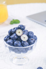 Fresh Yunnan King Blueberries in Glass Bowl - Big Organic Fruit with Cut Halves Showing White Flesh