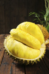 Fresh Golden Durian Flesh in Spiky Shell from Thailand - Tropical Exotic Fruit on Wooden Table