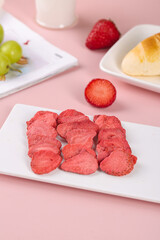Freeze Dried Strawberry Slices Healthy Snack Fresh Fruits Pink Background Light Bottom View