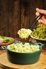 Fresh Cauliflower Florets with Chopsticks on Wooden Base - Healthy Vegetable Cooking Preparation
