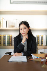 Professional Attorney. Young woman lawyer with thoughtful expression in office.