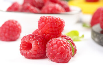 Fresh Red Raspberries and Cranberries on White Background - Organic Berry Collection