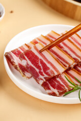 Raw Sliced Pork Belly with Chopsticks on White Plate - Traditional Asian Cooking Ingredient