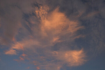 Blue sky background with orange clouds at sunrise. For graphic design, 3D rendering and banner...