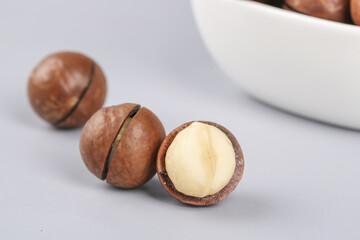Fresh Macadamia Nuts with Creamy Kernel Display on White Background