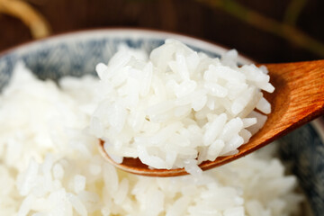 Fresh Cooked White Rice on Wooden Spoon Studio Shot Displaying Nutritional Value