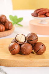 Fresh Macadamia Nuts on Wooden Board - Premium Imported Dried Nuts with Creamy White Kernels