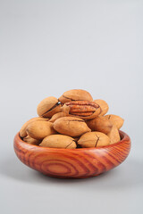 Delicious American Pecans in Wooden Bowl - Healthy Dried Fruit Nuts Food Photography