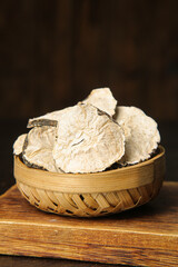 Dried Maca Root Slices in Bamboo Basket - Traditional Chinese Herbs from Yunnan Province