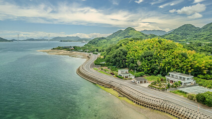 Aerial view of Omishima Island coastline and Tatara Bridge, Seto Inland Sea, Japan © Wei