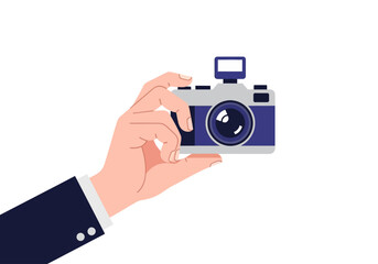 Hand holding blue and silver camera. Suitable for photography classes, workshops, or promotional material for photographyrelated events or businesses.