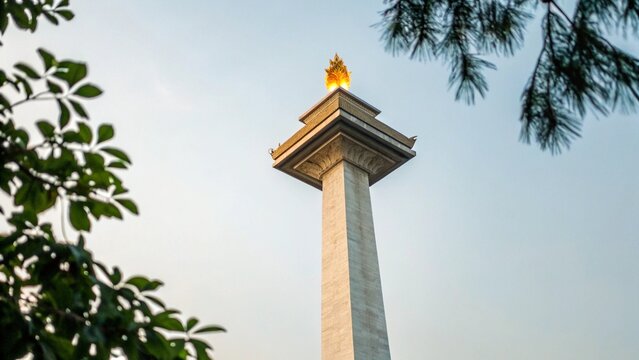 Low Angle View of National Monument Monas in Jakarta with Golden Flame Under Blue Sky