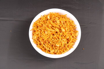 Farali Spicy Chevdo. Farali Chevda Indian Namkeen Farali Chevdo potato fries with peanut isolated served in black bowl. Gujarati Farshan. Deep Fried Spicy Chevdo.