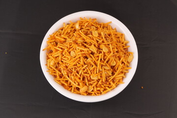 Indian snacks called Upwas Chivda or Upwas Special made fron Potatoes crispy and spicy serve on bowl isolated
