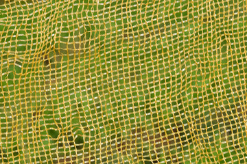 Yellow plastic net pattern and texture background. Ecology and environment concept. For graphic...