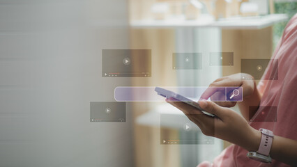 Online content search and video streaming concept with person using smartphone, digital interface and media icons representing social media, entertainment, digital marketing, and modern technology.