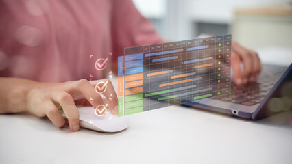 Project management concept with person using laptop and digital Gantt chart, representing business planning, task scheduling, workflow management, and project tracking in modern technology.