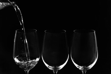 champagne glasses on black background
