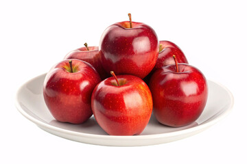 Red apples stacked on white plate displaying glossy crimson skin with natural shine and traditional round fruit shape for healthy eating.