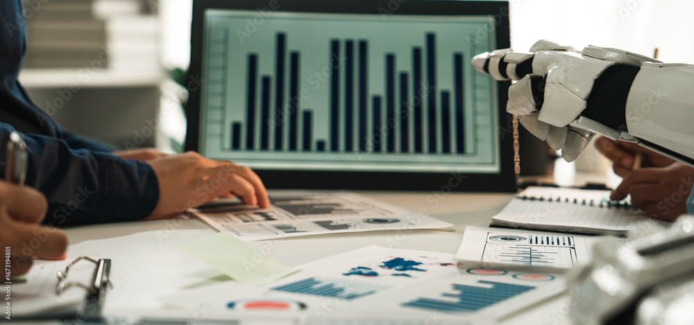 Poster a collaborative workspace scene featuring human hands and a robotic arm working together to analyze 