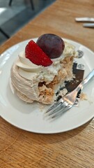 Colorful flowers blooming in a clay pot on a stone pavement. Decorative garden arrangement representing summer beauty and floral diversity