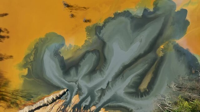 Patterns of acid mine drainage in decanting lake, nature pollution, aerial view