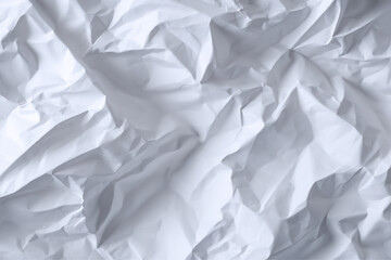 Obraz premium A close up view of crumpled white paper showing texture and shadows