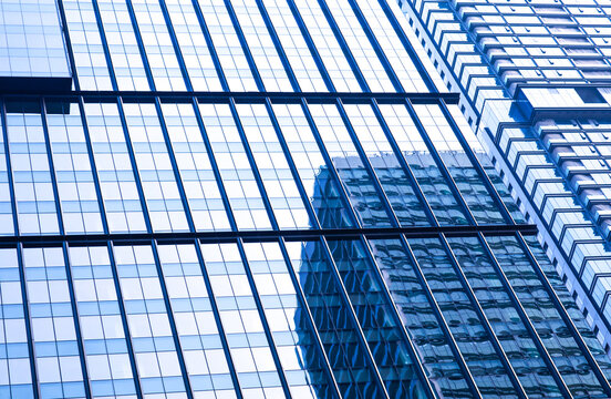 Low shot of visual dynamics of modern glass building background