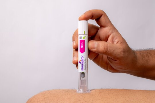 Close-up of a person using Mounjaro for type 2 diabetes management