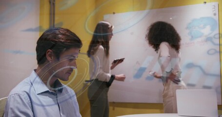 Animation of moving molecules over business people wearing phone headsets - Powered by Adobe