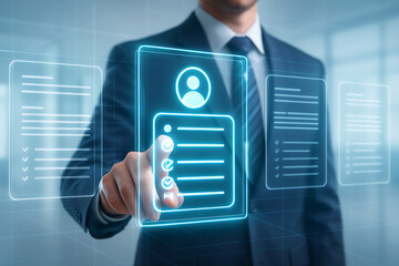 A businessman's hand is pointing at a digital screen displaying holographic documents to find the perfect candidate
