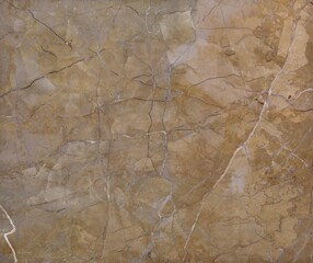 Detailed Close Up Texture of Natural Golden Brown Marble with Subtle Veins and Mineral Inclusions	