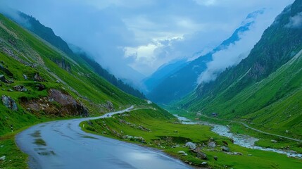 Scenic Mountain Road Winding Through Lush Green Valley Landscape sky fog path view calm blue mist