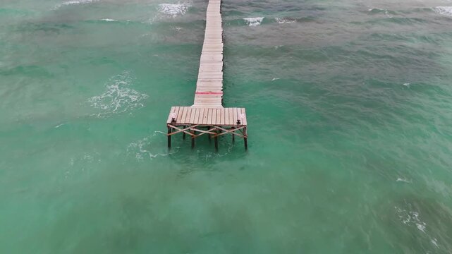 Aerial Drone Shot Flying Up And Over Moll De Fusta Pier At Can Picafort Beach, Mallorca, Spain