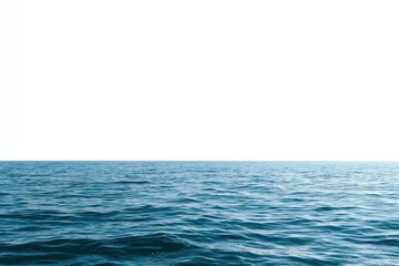 Obraz premium Open ocean Blue sea with slight ripples meets a vast, blank white sky. Horizon line centered