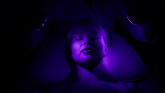 A young woman in close-up undergoing cryotherapy in a modern cosmetic center. Concept effective skin rejuvenation and restoration.