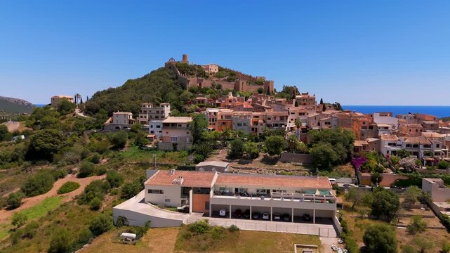 Aerial Drone Shot Closing In On Castell de Capdepera In Capdepera, Mallorca, Spain On A Bright Summer Day.