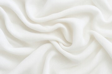 Obraz premium Elegant white fabric with flowing folds, creating a soft minimalist background in natural light, perfect for product presentation or design mockups. 